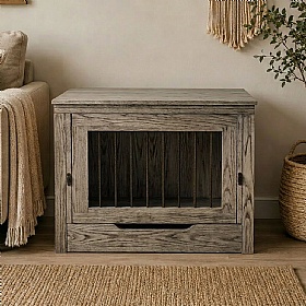 Dog resting in a furniture-style crate